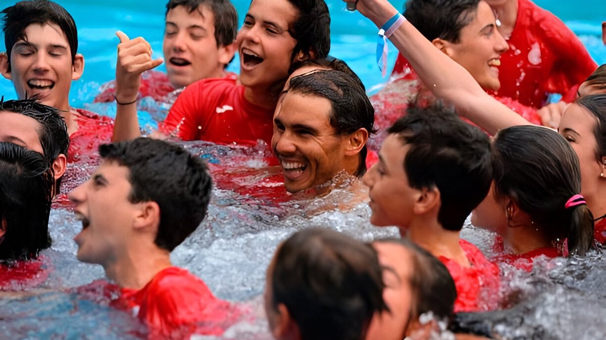 Rafael Nadal celebrating with ballboys and signing autographs.